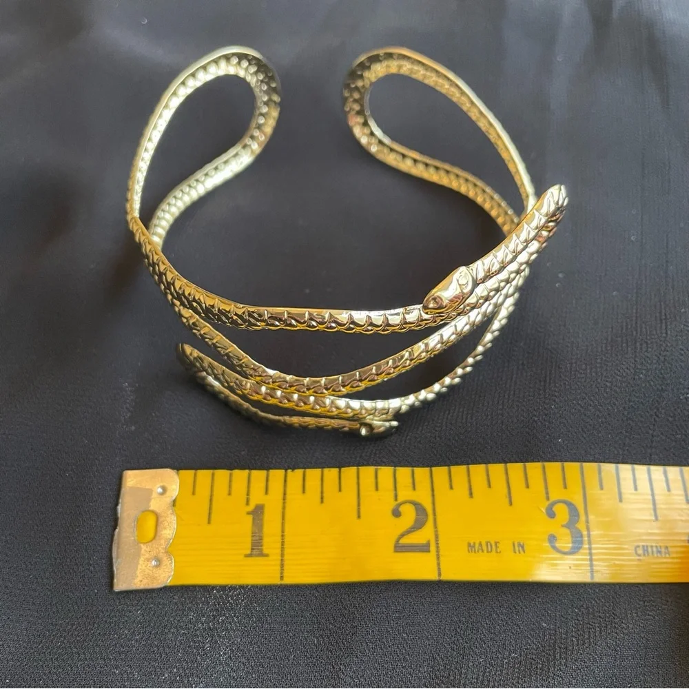 Gold tone metal snake arm cuff